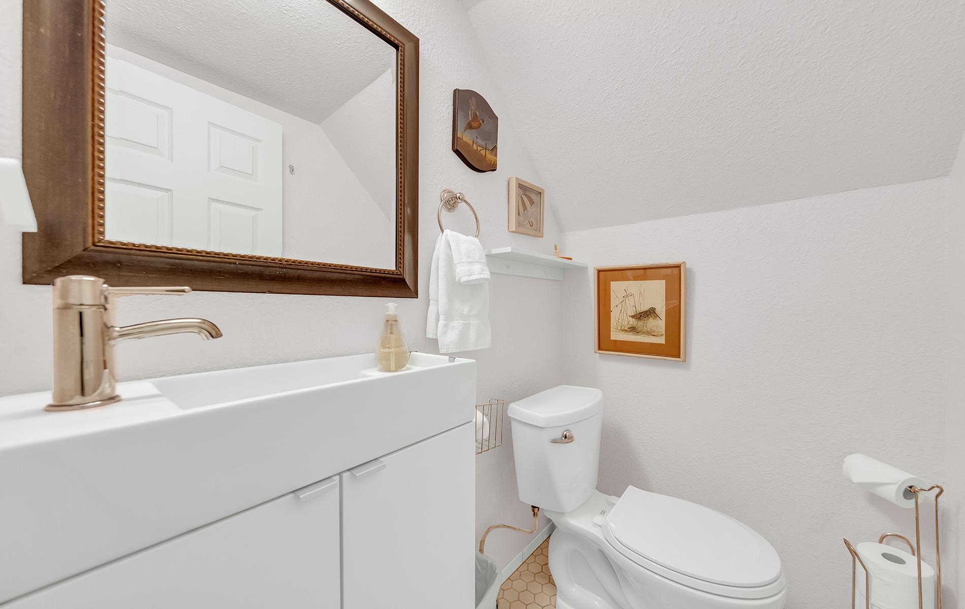 167 Stover Road Chester, CA 96020 - Photo 22 of 33 a bathroom with a sink a toilet and mirror