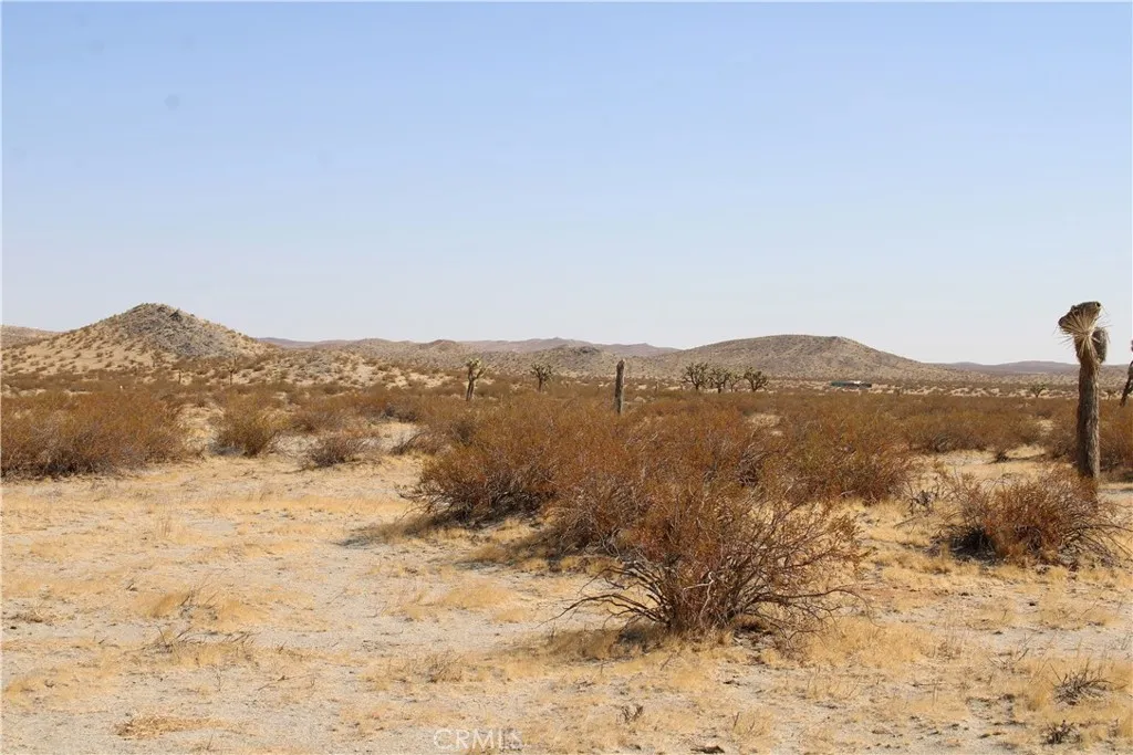 18 Lessing Road Adelanto, CA 92301 - Photo 10 of 19 a view of a lake with mountains in the background