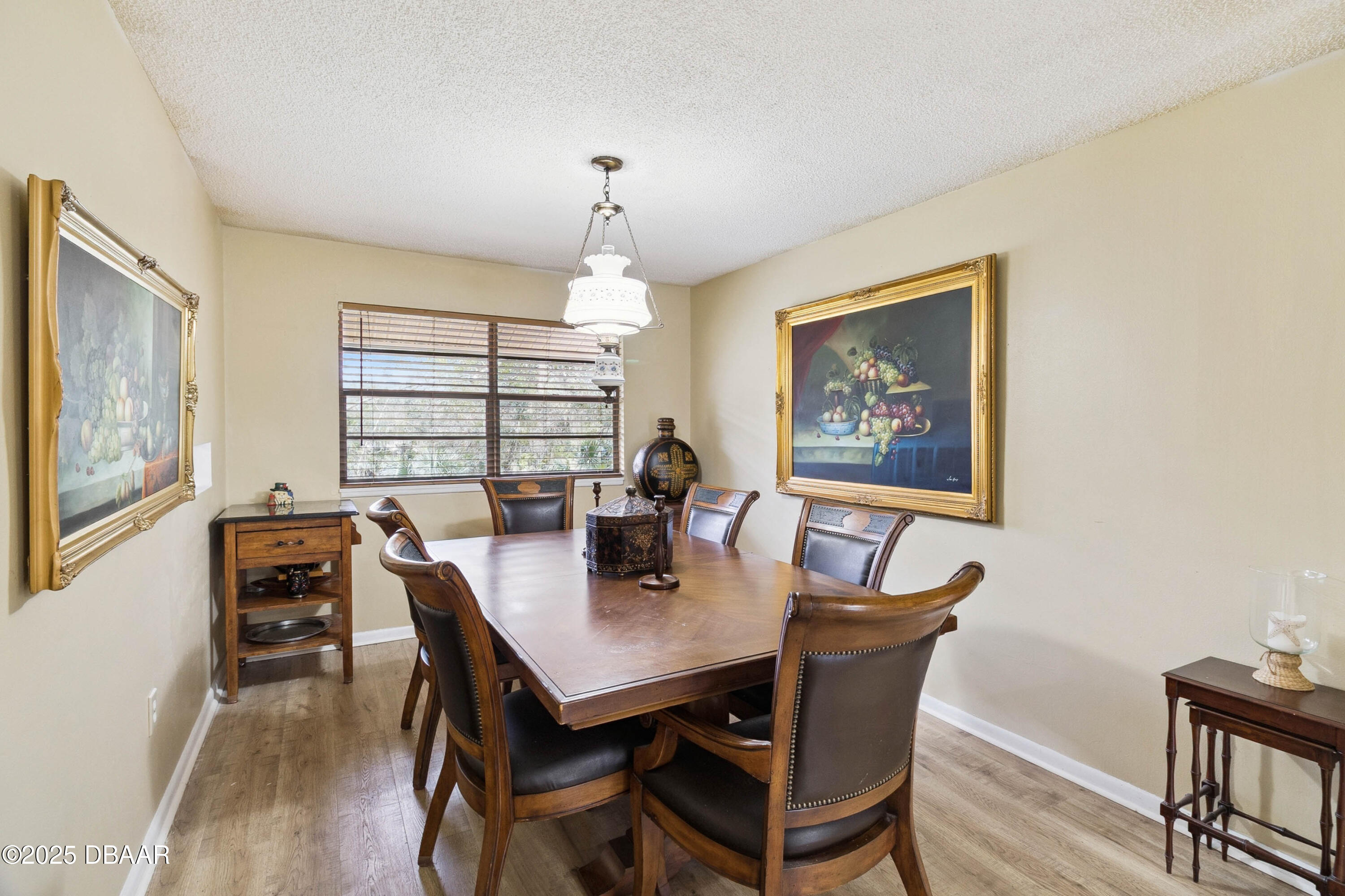 4191 Corey Road Grant Valkaria, FL 32950 - Photo 15 of 55 a view of a dining room with furniture window and wooden floor