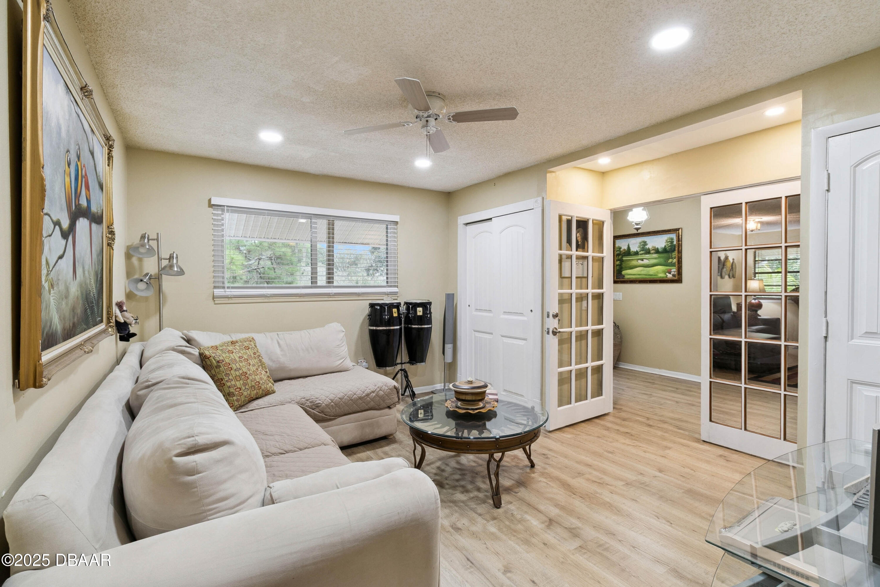 4191 Corey Road Grant Valkaria, FL 32950 - Photo 16 of 55 a living room with furniture and a window