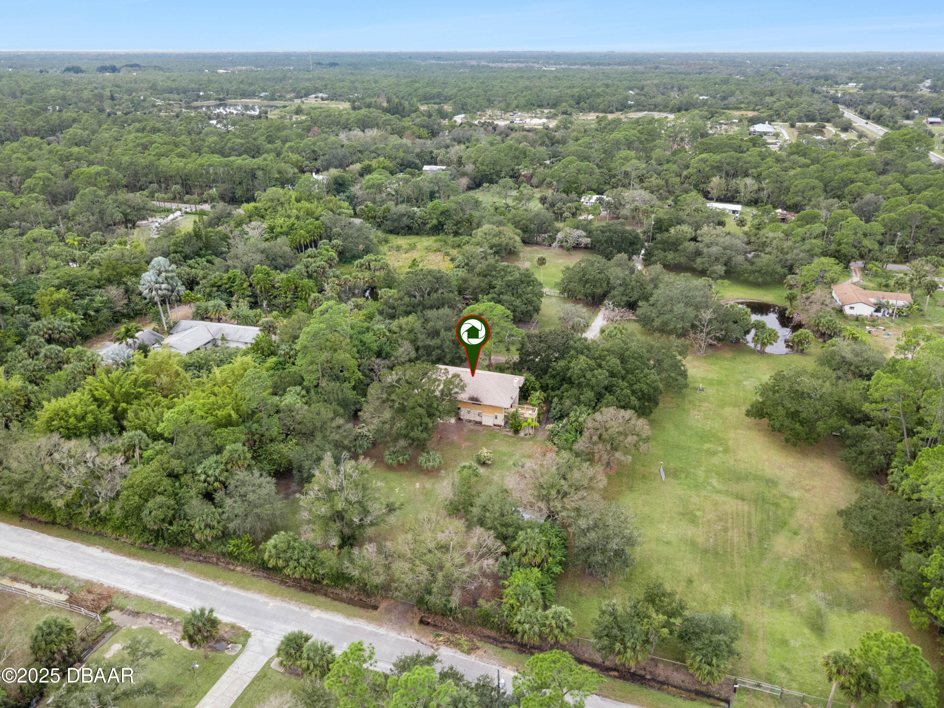 4191 Corey Road Grant Valkaria, FL 32950 - Photo 46 of 55 an aerial view of a house with a yard