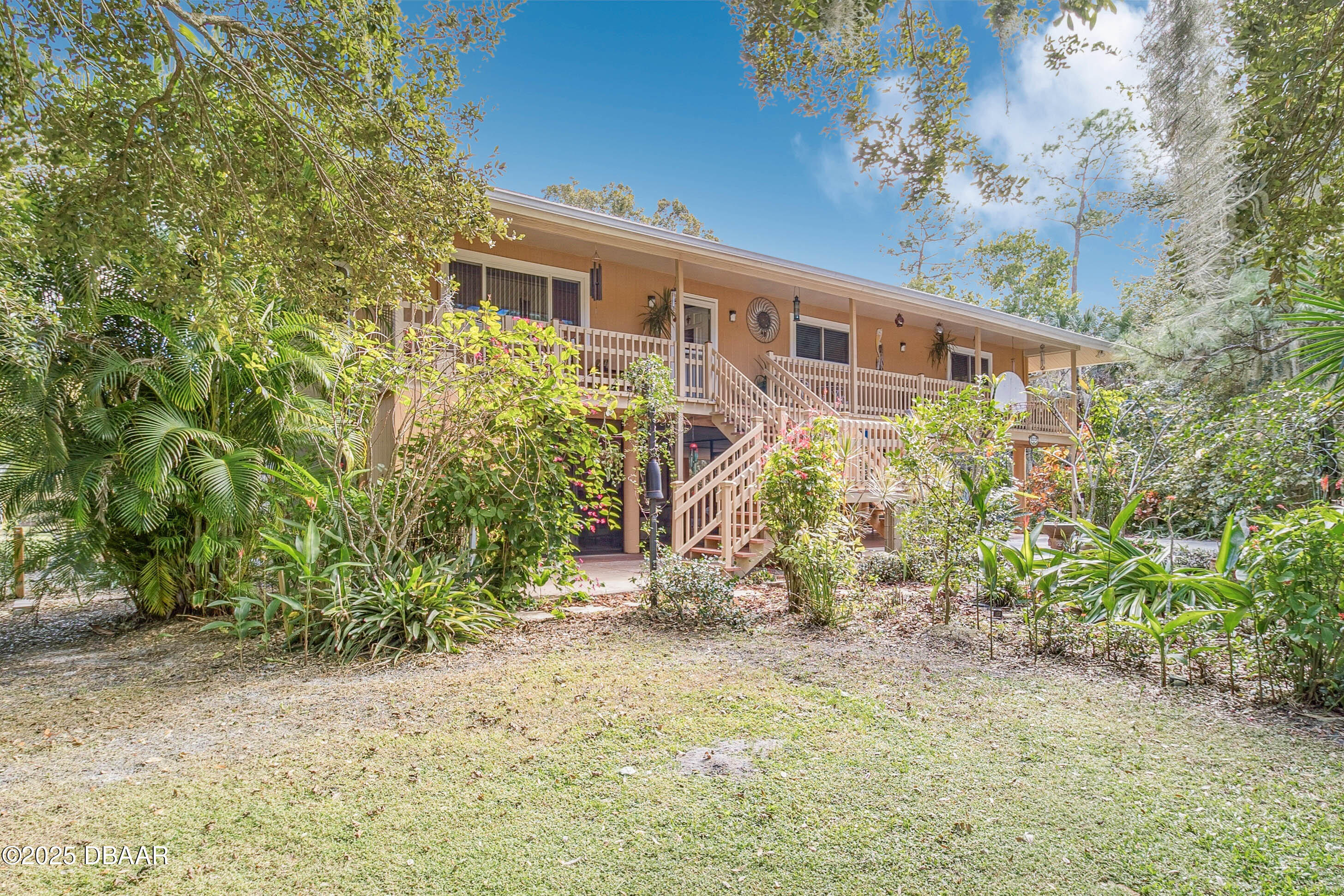4191 Corey Road Grant Valkaria, FL 32950 - Photo 8 of 55 a view of a house with a yard