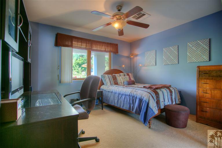 71339 Sahara Road Rancho Mirage, CA 92270 - Photo 12 of 18 a bedroom with a bed and wooden floor
