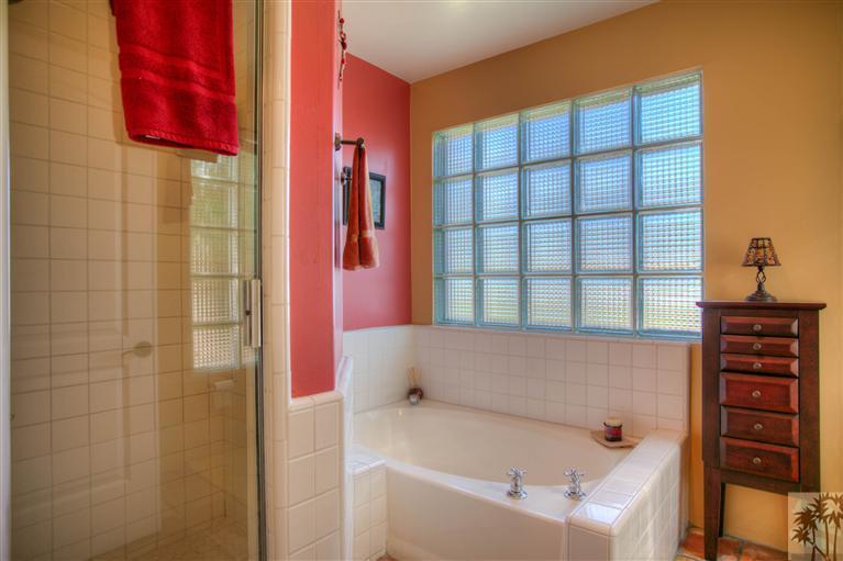 71339 Sahara Road Rancho Mirage, CA 92270 - Photo 15 of 18 a bathroom with a bathtub and shower