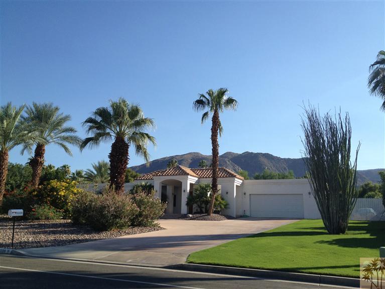 71339 Sahara Road Rancho Mirage, CA 92270 - Photo 2 of 18 a front view of a house with garden