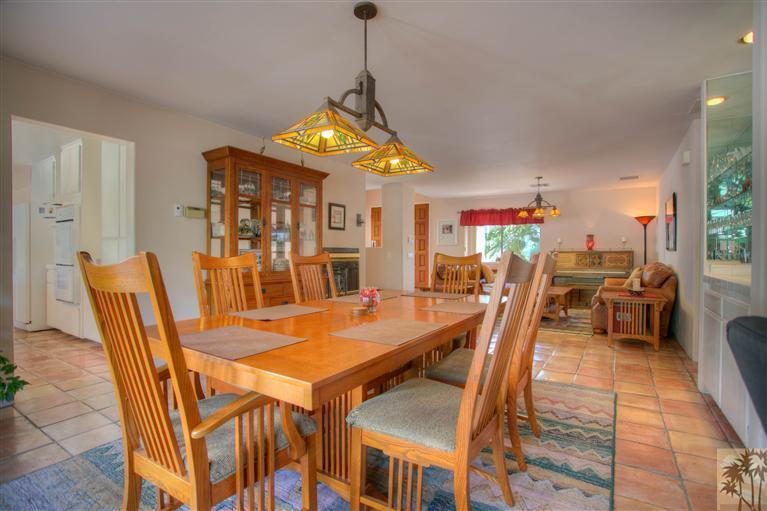 71339 Sahara Road Rancho Mirage, CA 92270 - Photo 5 of 18 a view of a dining room with furniture and wooden floor