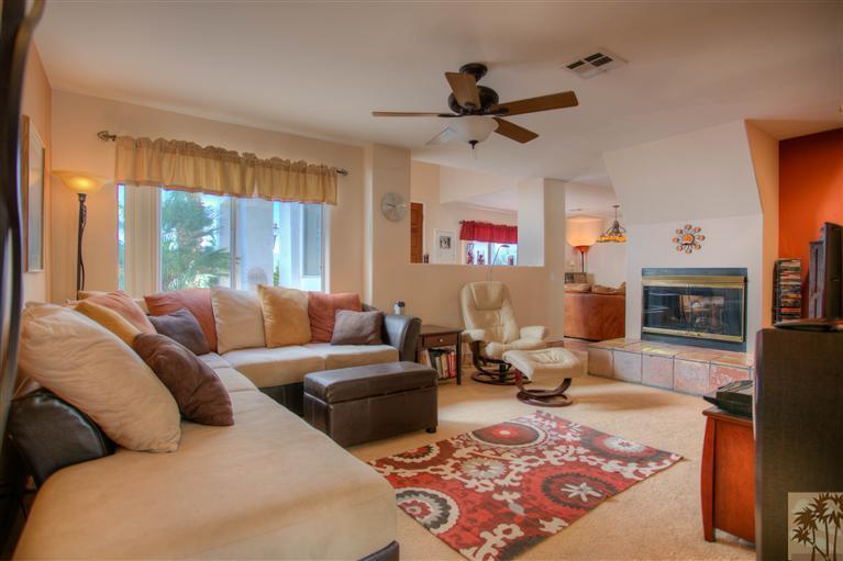 71339 Sahara Road Rancho Mirage, CA 92270 - Photo 9 of 18 a living room with furniture windows and a fireplace