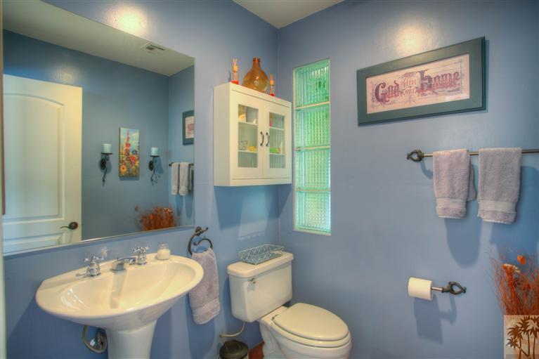71339 Sahara Road Rancho Mirage, CA 92270 - Photo 10 of 18 a bathroom with a toilet sink and mirror