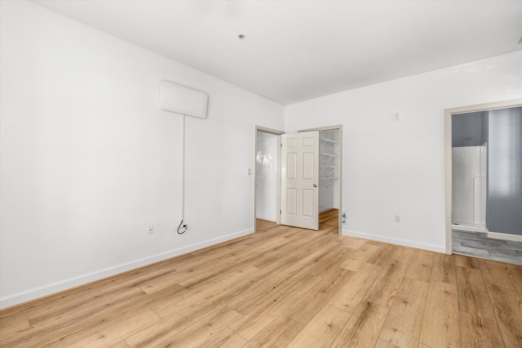 21 Hampshire Road, Unit 101 Methuen, MA 01844 - Photo 17 of 18 an empty room with wooden floor