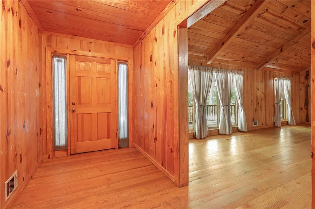 7505 Hall Road Fairburn, GA 30213 - Photo 11 of 43 a view of an empty room with wooden floor and a window