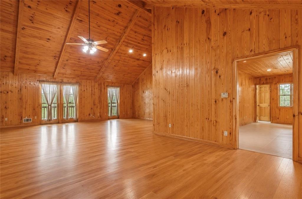 7505 Hall Road Fairburn, GA 30213 - Photo 16 of 43 a view of empty room with wooden floor and fan