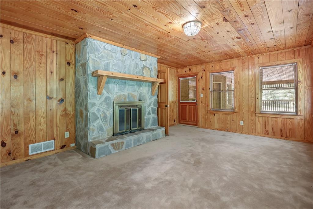 7505 Hall Road Fairburn, GA 30213 - Photo 17 of 43 a view of an empty room with a fireplace and a window
