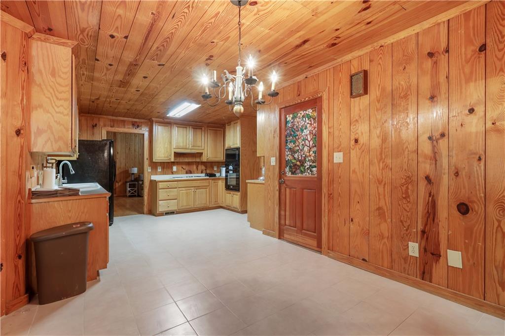 7505 Hall Road Fairburn, GA 30213 - Photo 21 of 43 a open kitchen with cabinets and stainless steel appliances