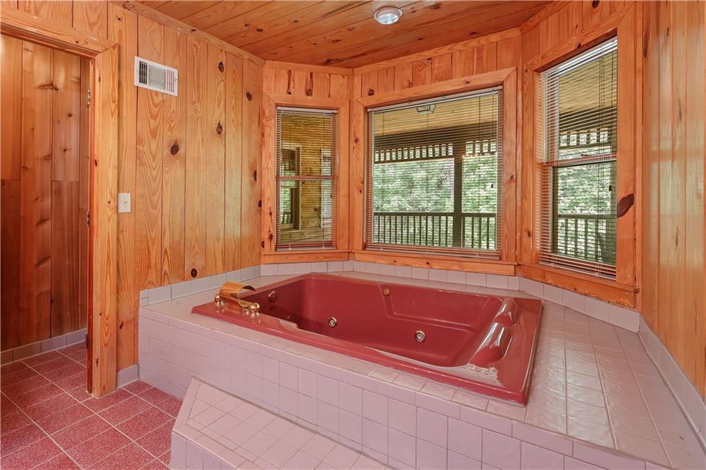 7505 Hall Road Fairburn, GA 30213 - Photo 29 of 43 a bath tub sitting in a bathroom next to a window