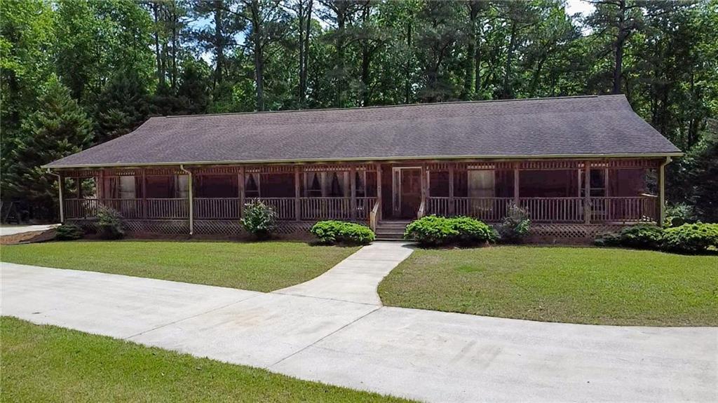 7505 Hall Road Fairburn, GA 30213 - Photo 3 of 43 a house view with a garden space