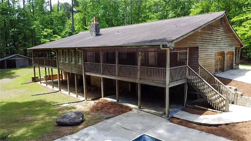 7505 Hall Road Fairburn, GA 30213 - Photo 5 of 43 a backyard of a house with seating space