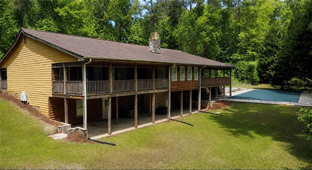 7505 Hall Road Fairburn, GA 30213 - Photo 8 of 43 a view of a house with a yard and potted plants