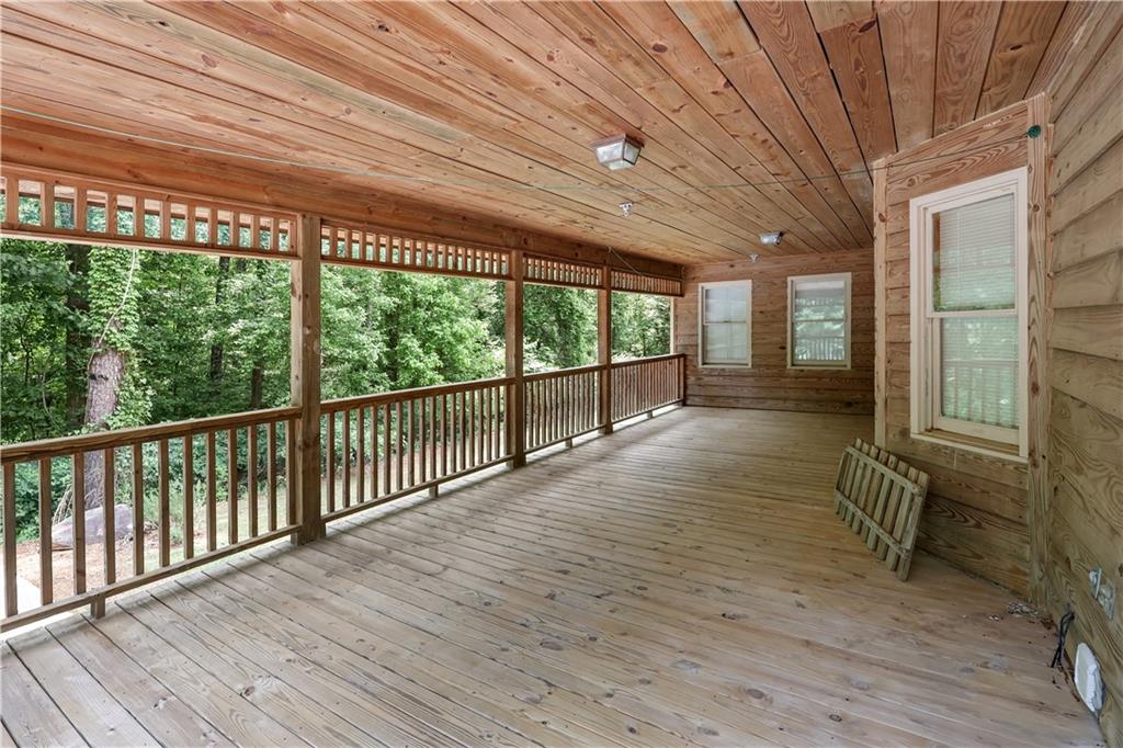 7505 Hall Road Fairburn, GA 30213 - Photo 9 of 43 a view of a porch with wooden floor