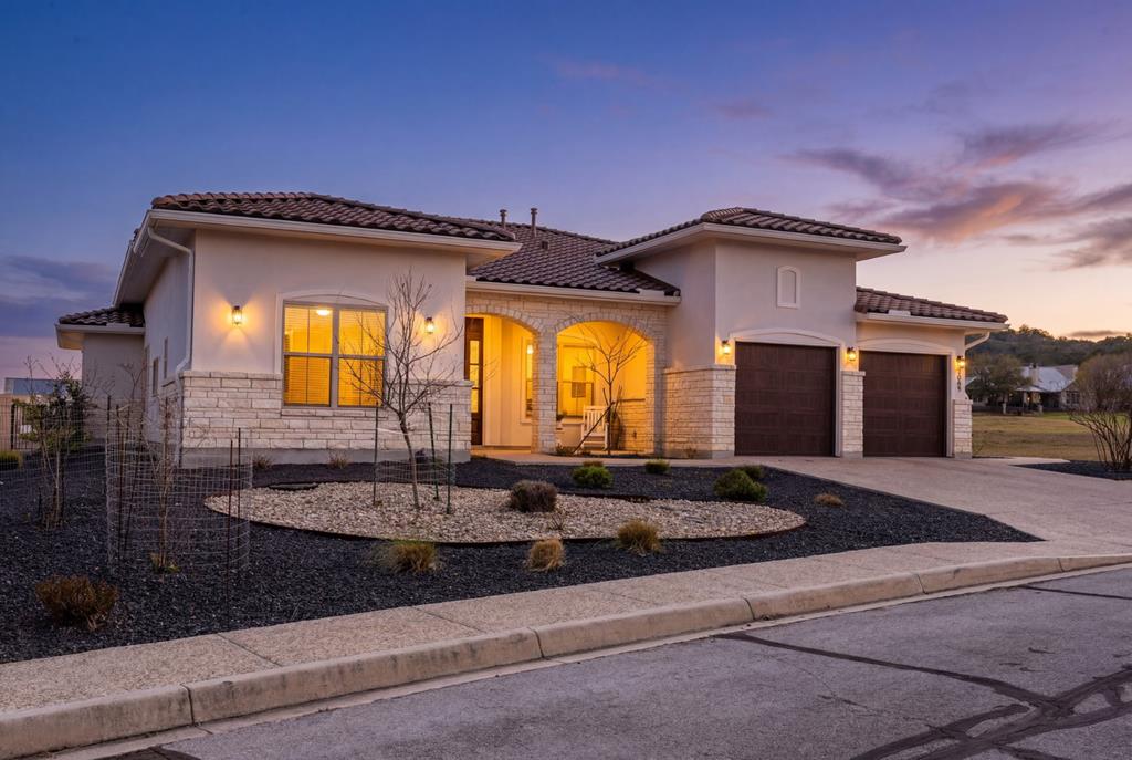 2085 Toscano Way Kerrville, TX 78028 - Photo 1 of 36 a front view of a house with a swimming pool