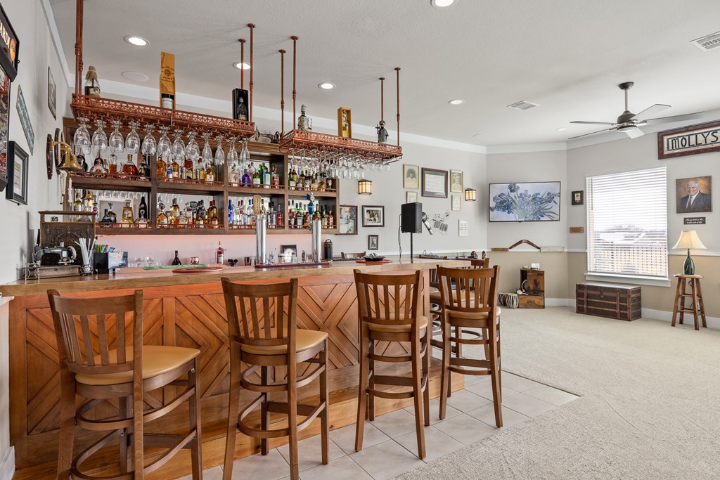 2085 Toscano Way Kerrville, TX 78028 - Photo 15 of 36 a dinning area with stainless steel appliances kitchen island granite countertop a table and chairs