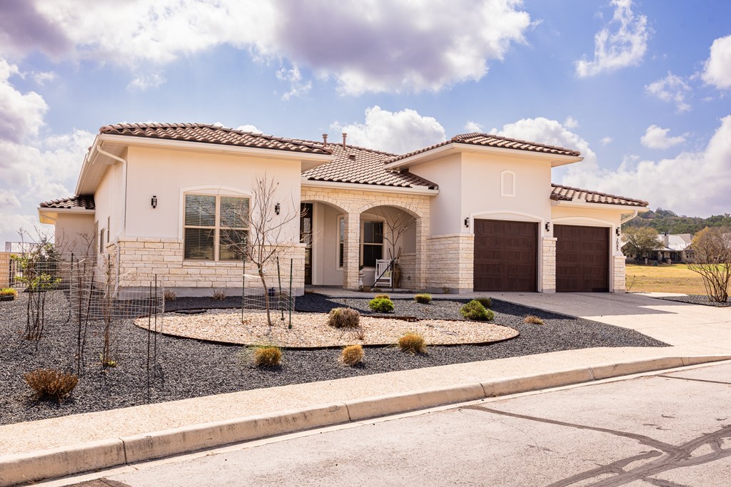 2085 Toscano Way Kerrville, TX 78028 - Photo 2 of 36 a front view of a house with entertaining space