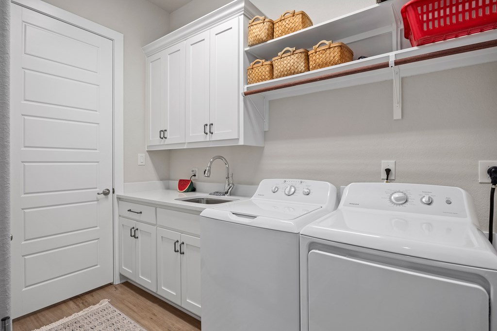 2085 Toscano Way Kerrville, TX 78028 - Photo 23 of 36 a utility room with dryer and washer