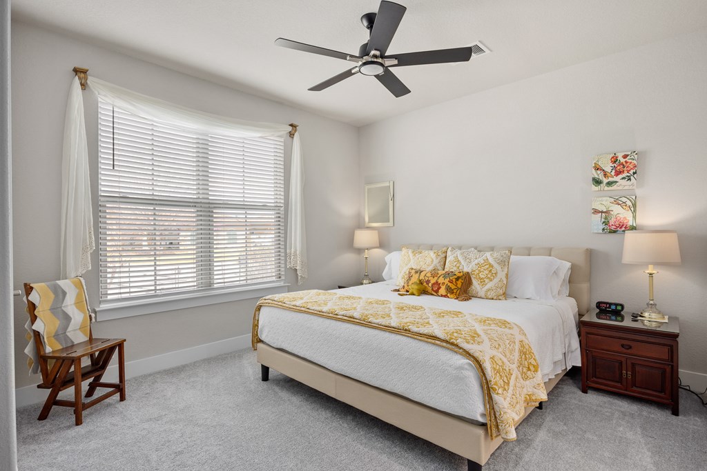 2085 Toscano Way Kerrville, TX 78028 - Photo 24 of 36 a bedroom with a bed and a window