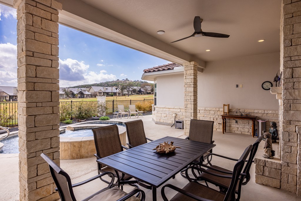 2085 Toscano Way Kerrville, TX 78028 - Photo 28 of 36 a view of a roof deck with table and chairs