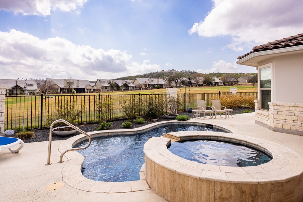 2085 Toscano Way Kerrville, TX 78028 - Photo 29 of 36 a view of a swimming pool with a lake view