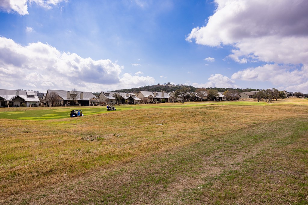 2085 Toscano Way Kerrville, TX 78028 - Photo 32 of 36 a view of a lake with houses in the background