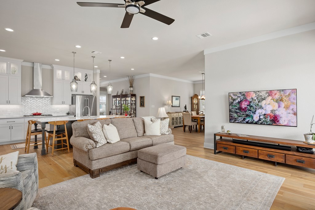 2085 Toscano Way Kerrville, TX 78028 - Photo 6 of 36 a living room with furniture and kitchen view