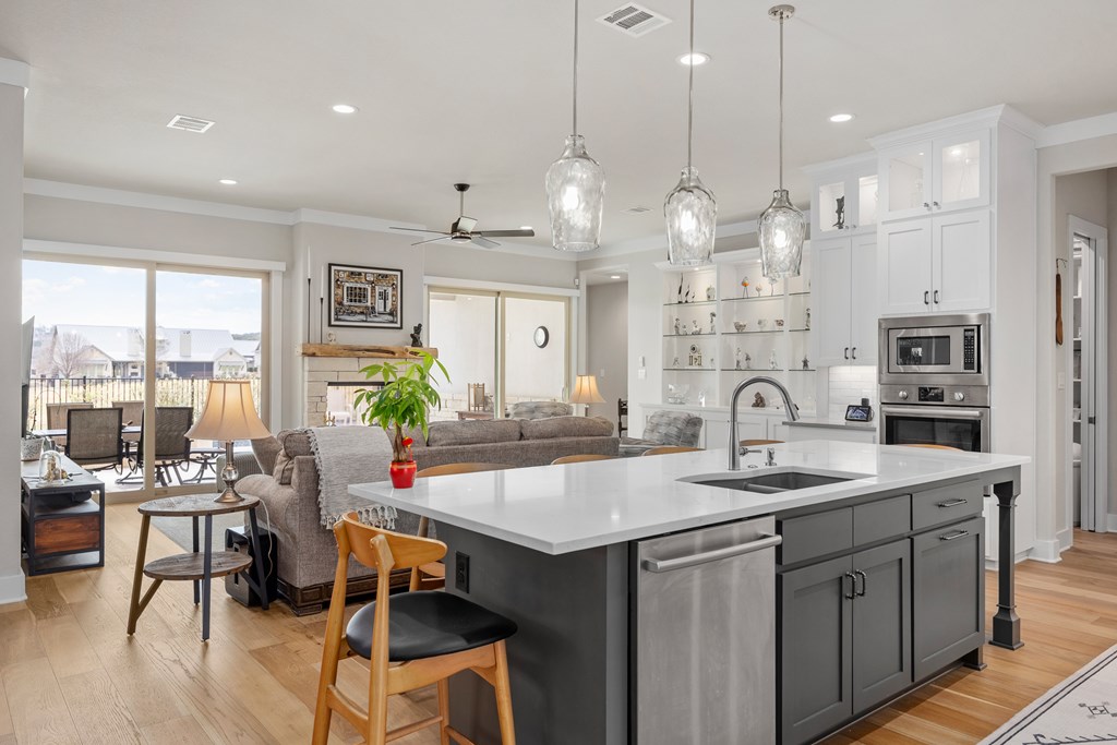 2085 Toscano Way Kerrville, TX 78028 - Photo 7 of 36 a large kitchen with kitchen island a large island in it