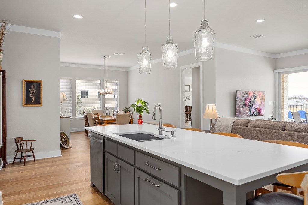 2085 Toscano Way Kerrville, TX 78028 - Photo 10 of 36 a living room with furniture and a chandelier