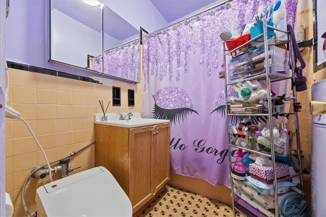a bathroom with a toilet and shower