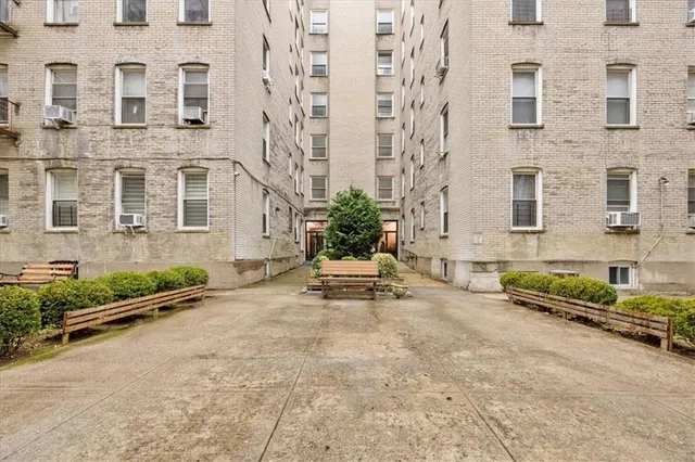 front view of a brick house with windows