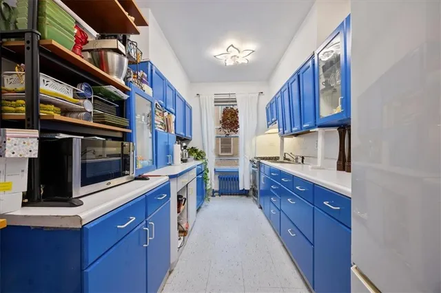 a kitchen with stainless steel appliances granite countertop a stove and a microwave