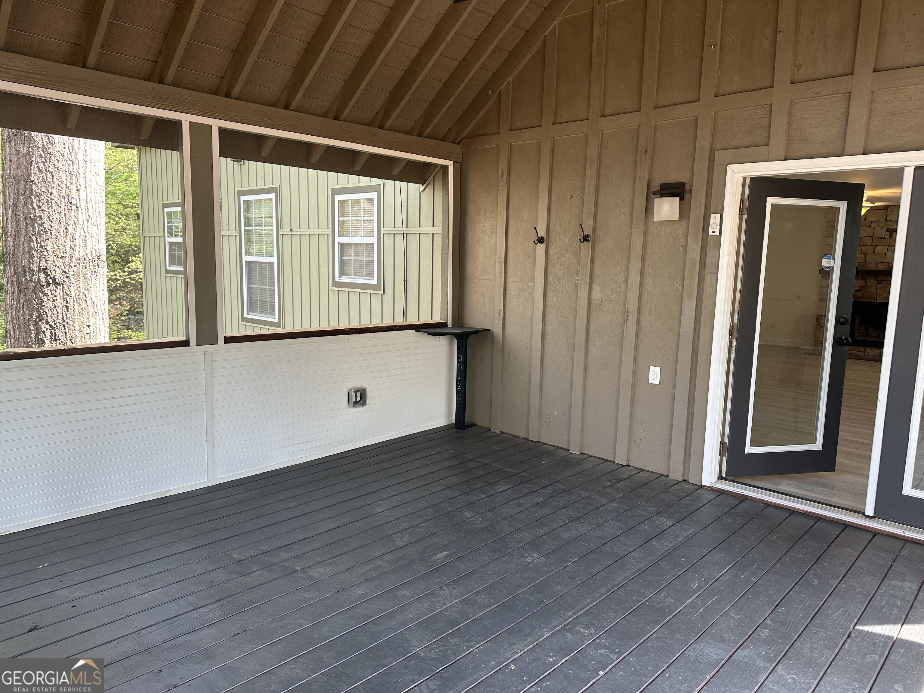 3114 The Trail Road Gainesville, GA 30501 - Photo 13 of 32 a view of an empty room with wooden floor and a window