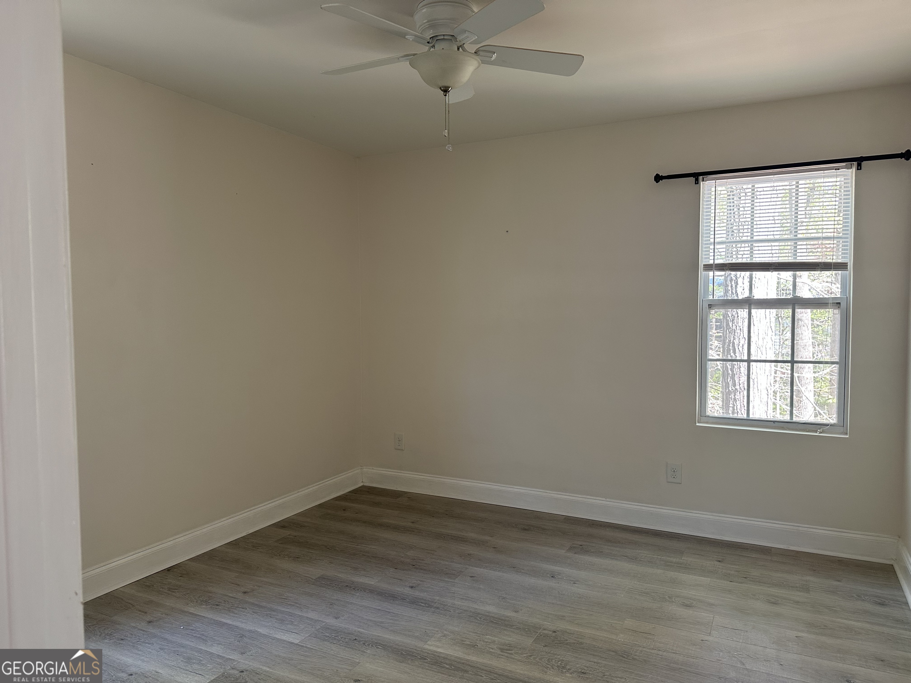 3114 The Trail Road Gainesville, GA 30501 - Photo 21 of 32 an empty room with a window