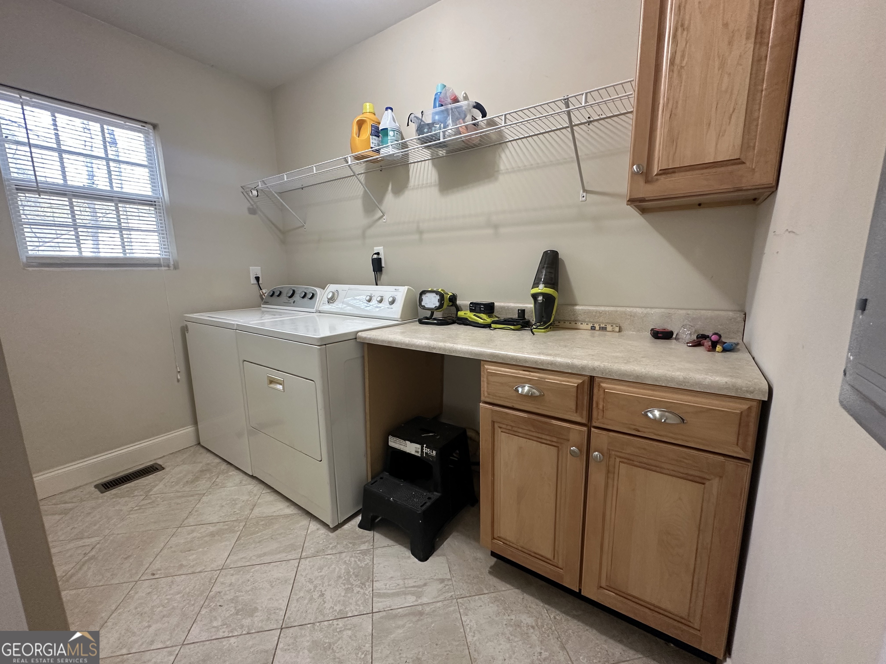 3114 The Trail Road Gainesville, GA 30501 - Photo 22 of 32 a utility room with cabinets washer and dryer