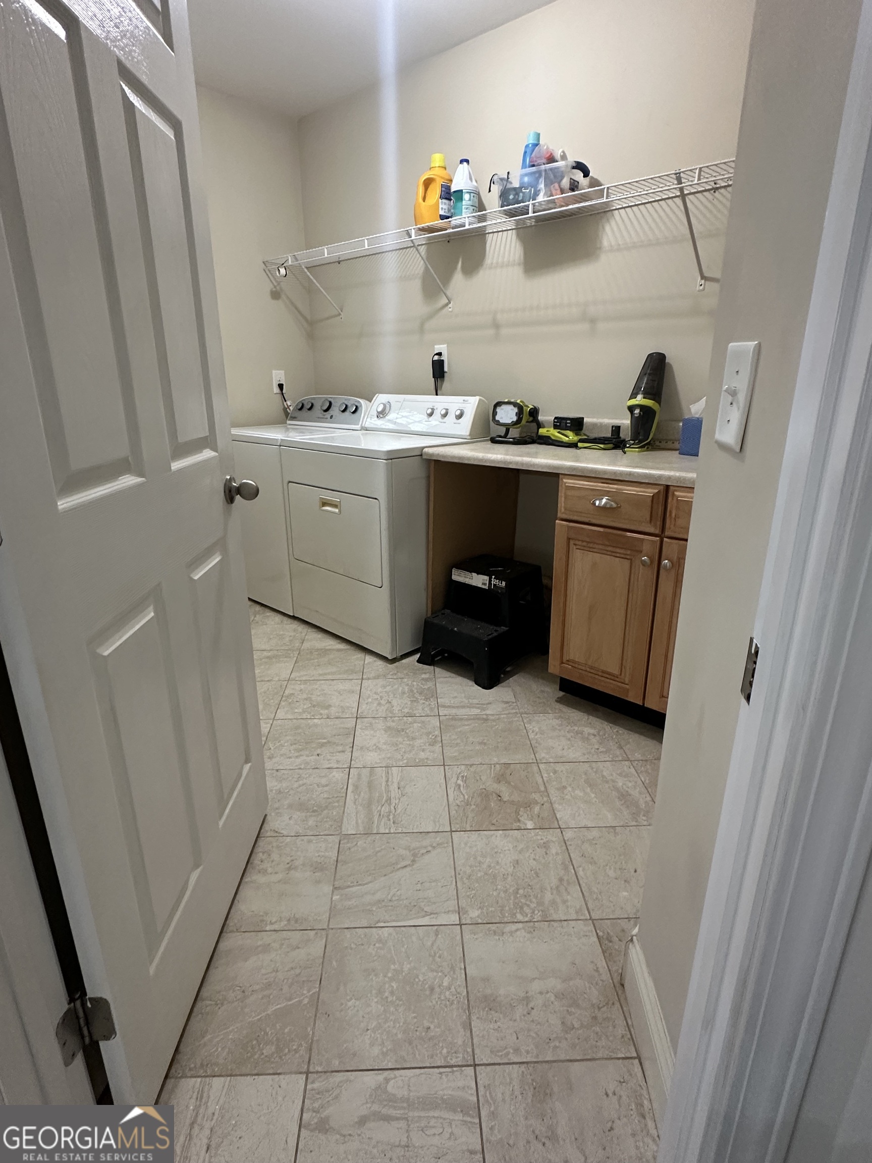 3114 The Trail Road Gainesville, GA 30501 - Photo 23 of 32 a kitchen with a sink a stove and cabinets