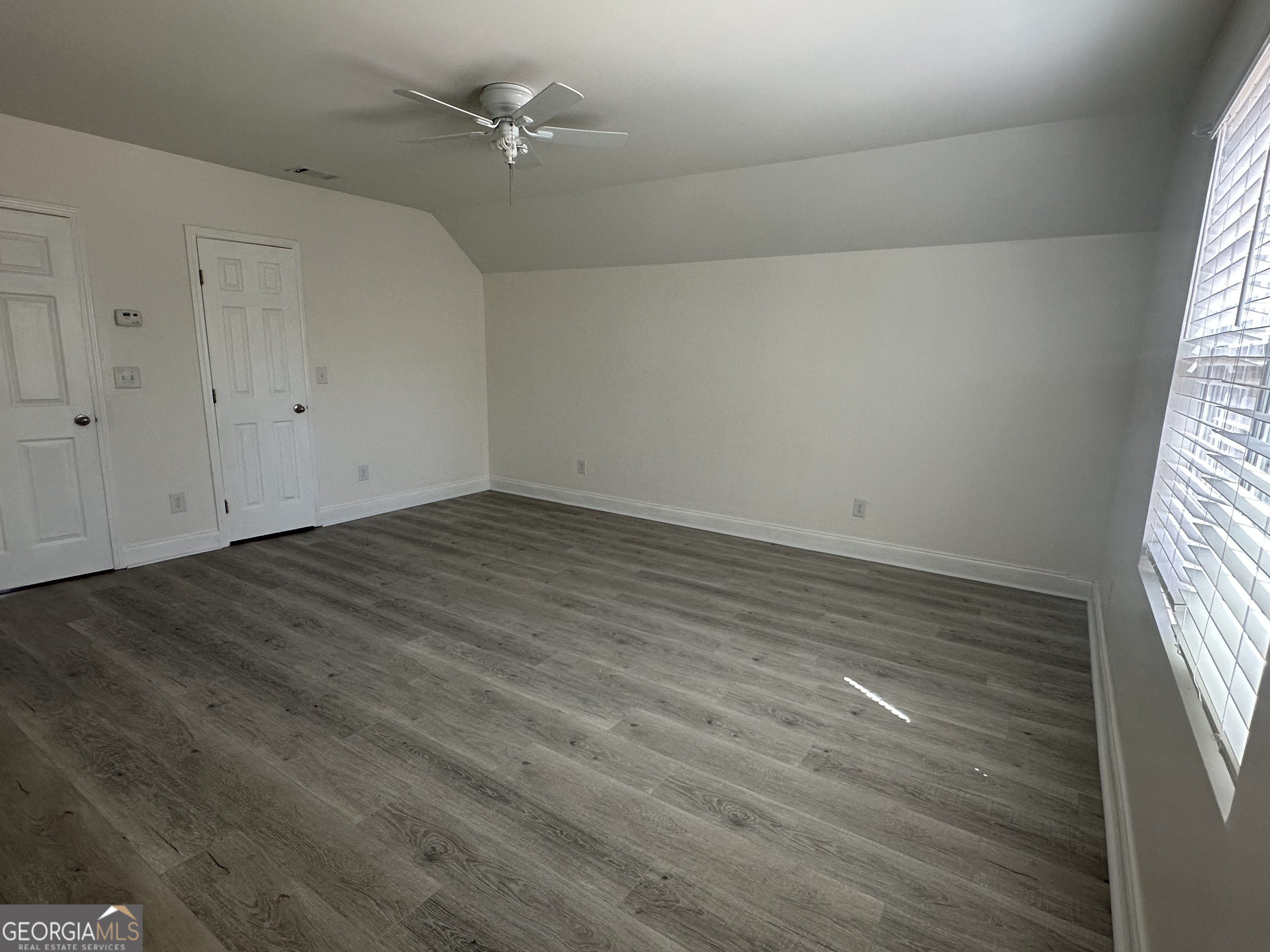 3114 The Trail Road Gainesville, GA 30501 - Photo 25 of 32 wooden floor in an empty room with a window