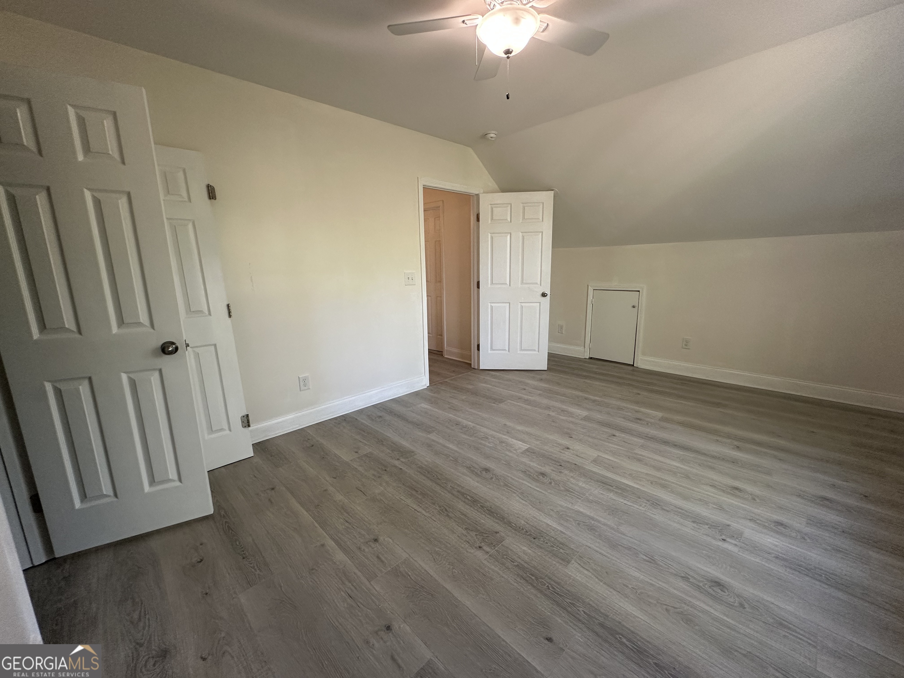 3114 The Trail Road Gainesville, GA 30501 - Photo 28 of 32 a view of an empty room with wooden floor
