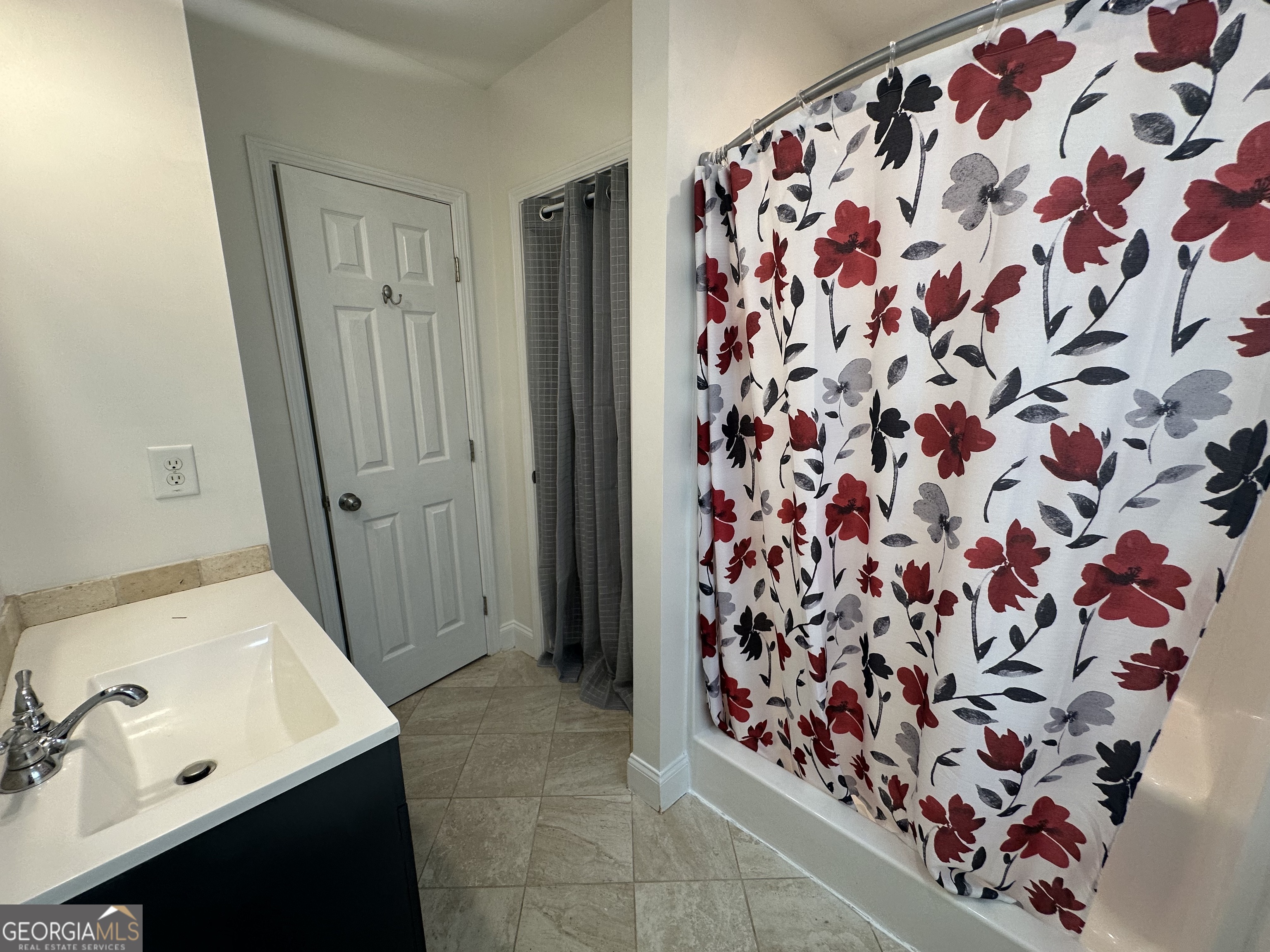 3114 The Trail Road Gainesville, GA 30501 - Photo 29 of 32 a bathroom with a sink and mirror with curtain