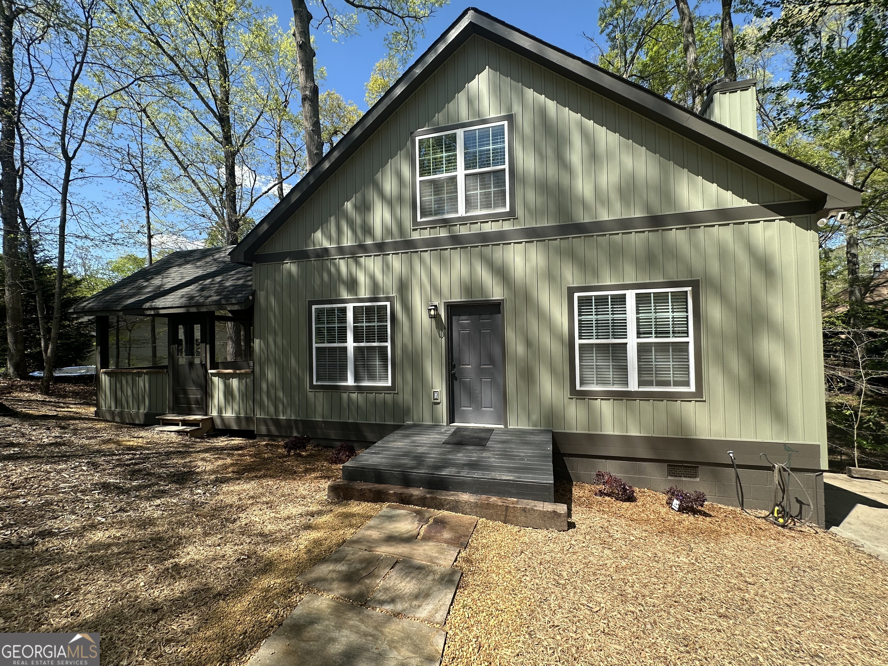 3114 The Trail Road Gainesville, GA 30501 - Photo 4 of 32 a front view of a house with a yard