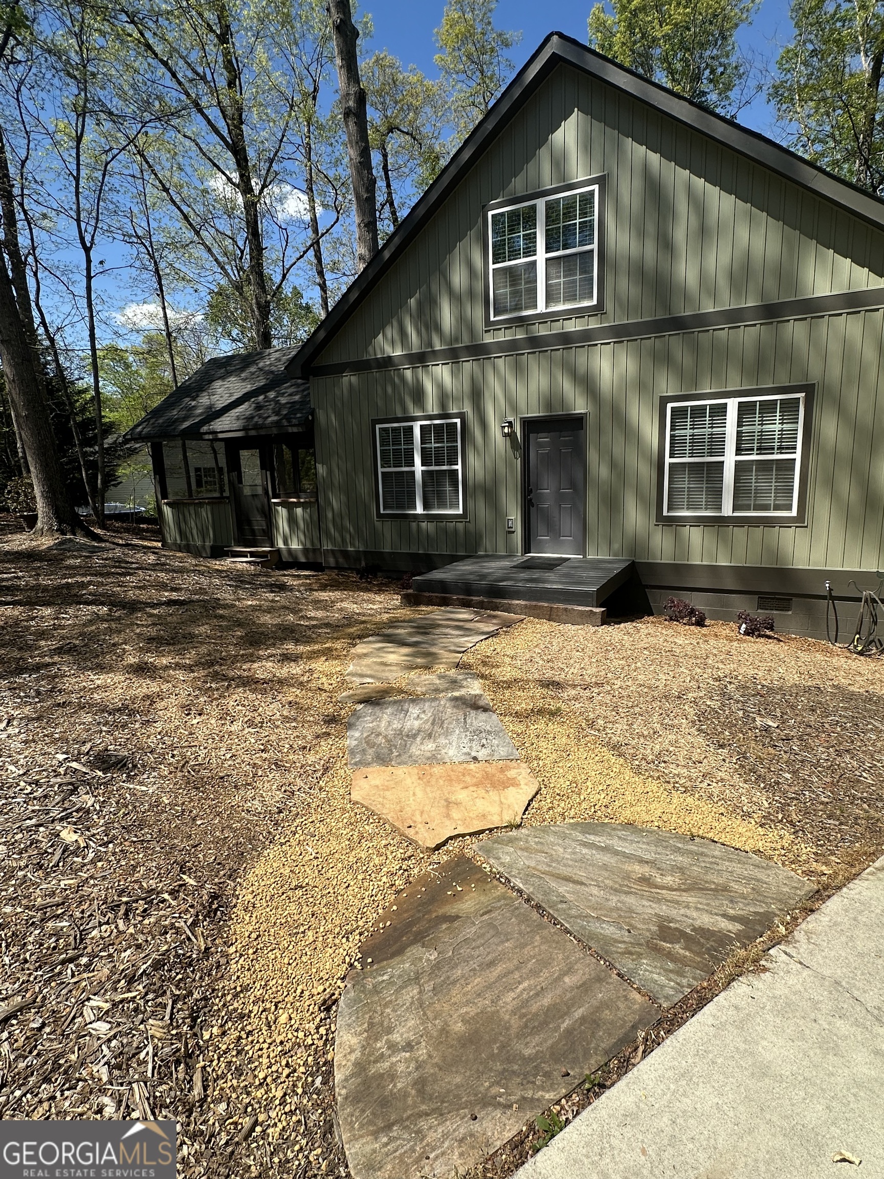 3114 The Trail Road Gainesville, GA 30501 - Photo 6 of 32 a front view of a house with a yard