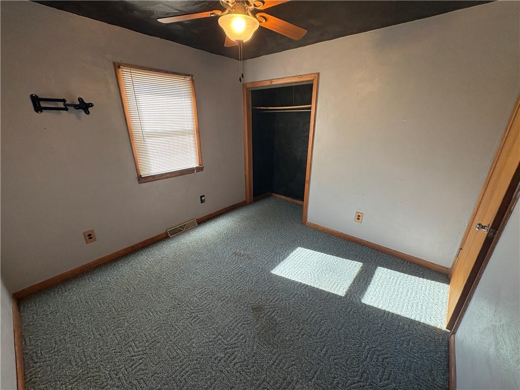 581 Yates Road Punxsutawney, PA 15767 - Photo 14 of 24 an empty room with windows and fan