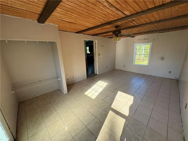 a view of a kitchen with a sink dishwasher and fireplace