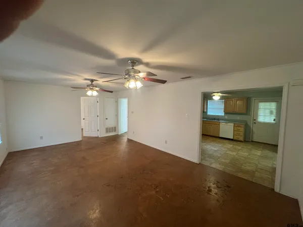 a kitchen with stainless steel appliances granite countertop a refrigerator a stove a sink and a microwave