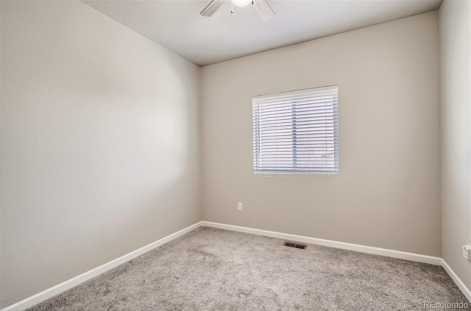 4718 River Highlands Loop Elizabeth, CO 80107 - Photo 19 of 28 an empty room with a window