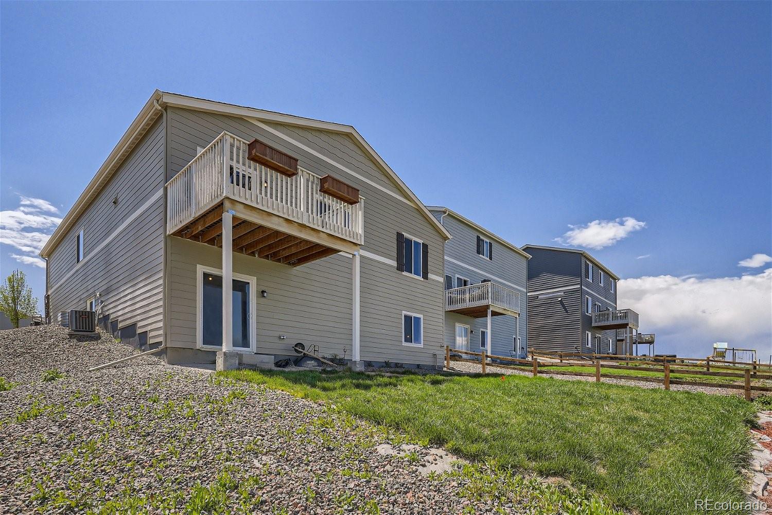 4718 River Highlands Loop Elizabeth, CO 80107 - Photo 28 of 28 a front view of a house with a yard